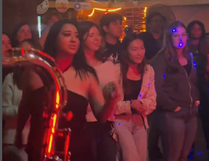 Crowd dancing during saxophone set